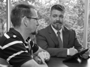 Flint Buchanan discusses course creation with a UGA faculty member.